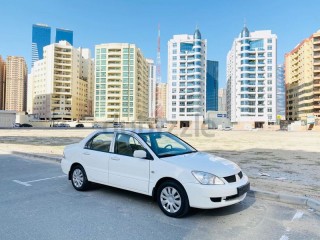  BRAND NEW CONDITION MITSUBISHI LANCER GLX 2011 WHITE GCC SPECS VERY LESS KM IN EXCELLENT CONDITION 