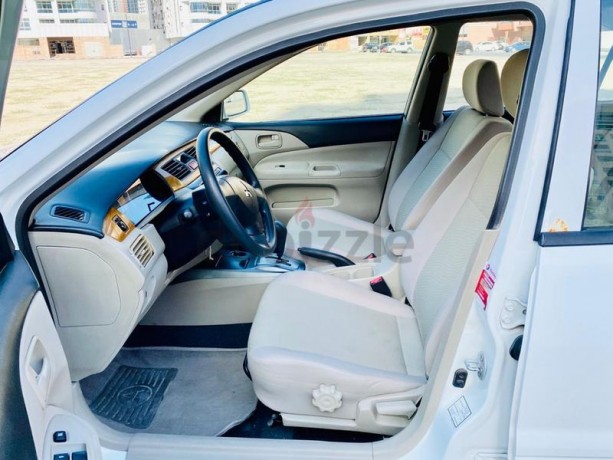 brand-new-condition-mitsubishi-lancer-glx-2011-white-gcc-specs-very-less-km-in-excellent-condition-big-9