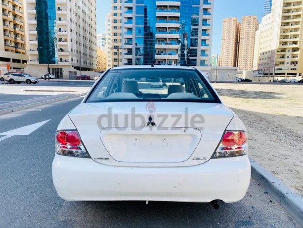 brand-new-condition-mitsubishi-lancer-glx-2011-white-gcc-specs-very-less-km-in-excellent-condition-big-4
