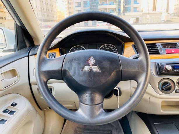 brand-new-condition-mitsubishi-lancer-glx-2011-white-gcc-specs-very-less-km-in-excellent-condition-big-3