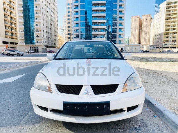 brand-new-condition-mitsubishi-lancer-glx-2011-white-gcc-specs-very-less-km-in-excellent-condition-big-0
