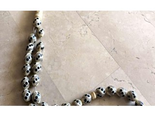 
                        ivory and silver rosary                                            