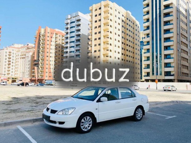 brand-new-condition-mitsubishi-lancer-glx-2011-white-gcc-specs-very-less-km-in-excellent-condition-big-2